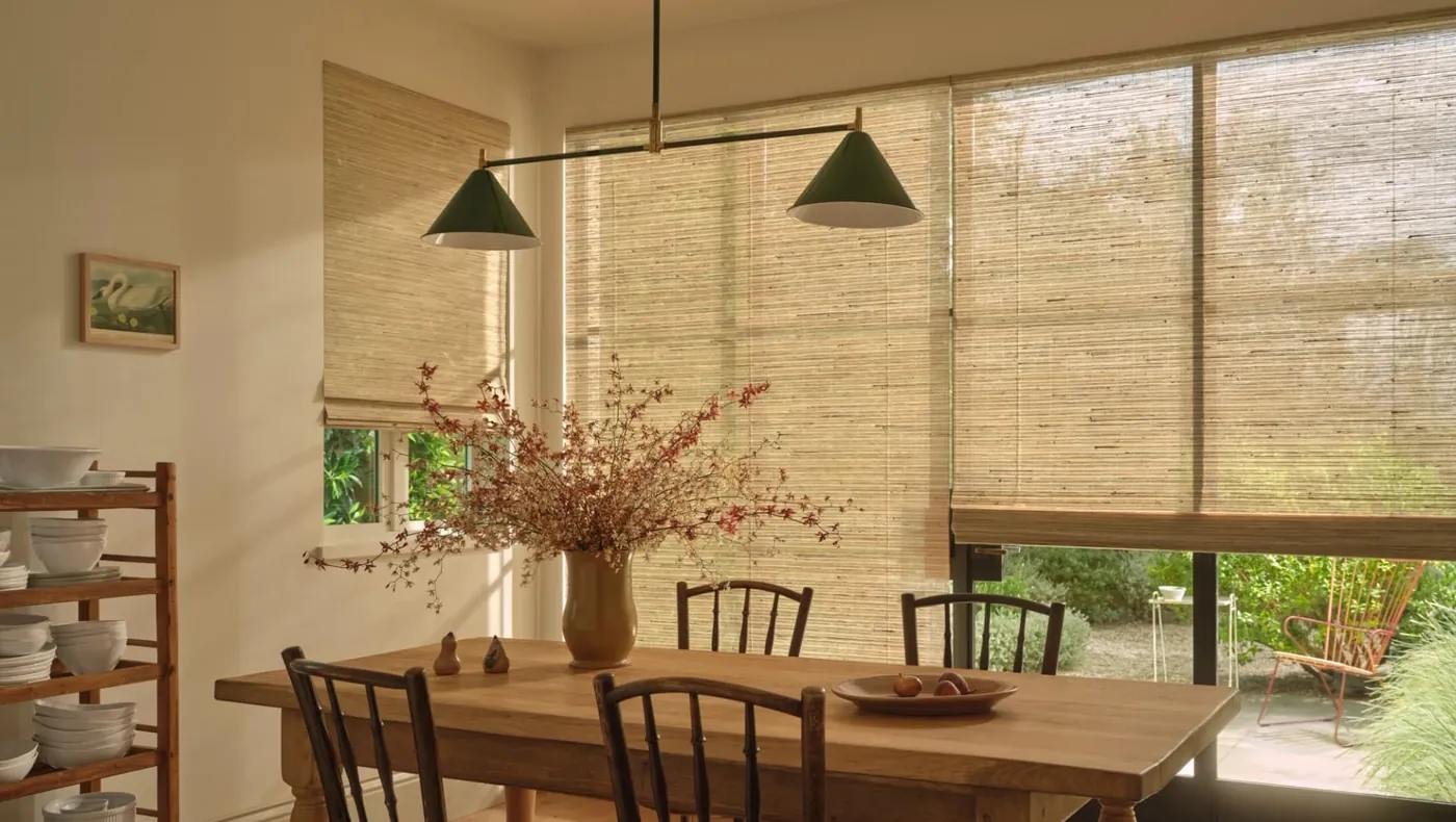 Hunter Douglas woven wood shades with PowerView automation in a dining room